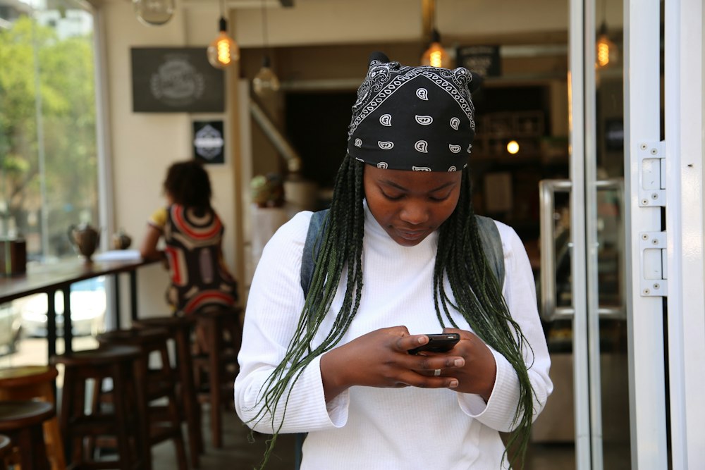 Woman on her phone at a cafe